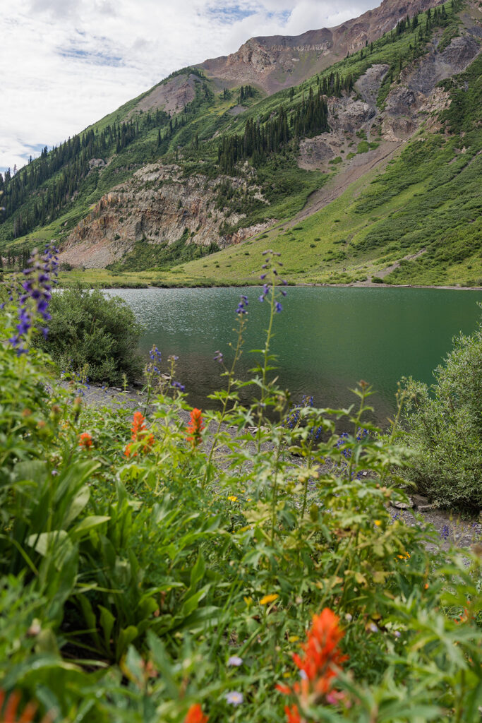 A vibrant alpine lake and wildflowers in Crested Butte, Colorado